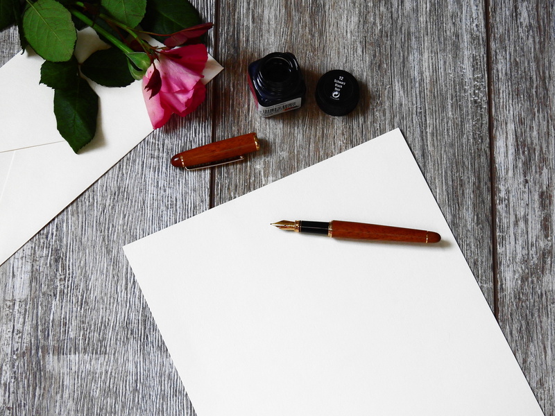 flowering plant, paper, red, letters, writing utensil, printer, beauty in nature, blank, rose, fountain, nature, close-up, blossom, pen, communicate, high angle view