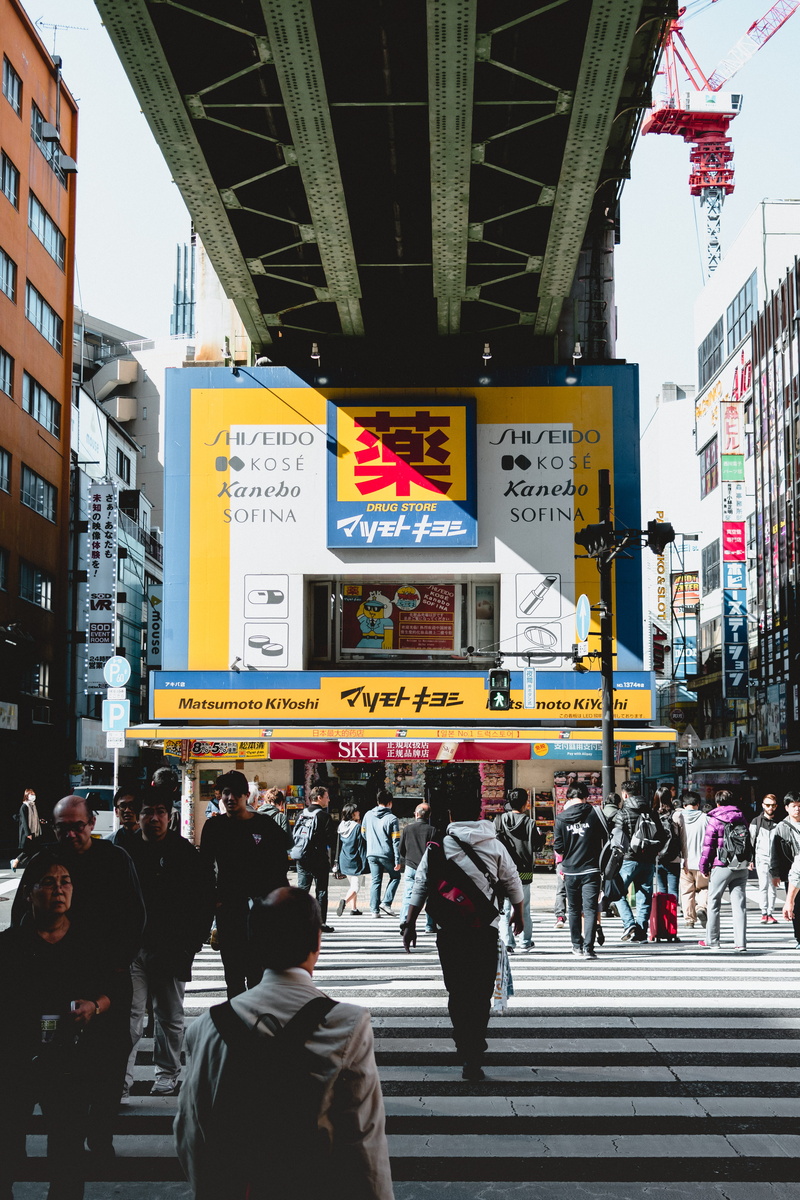 group of people, script, real people, downtown, city street, outdoors, metropolis, road, urban, asphalt, human, zebra crossing, 5K, people, town, banner