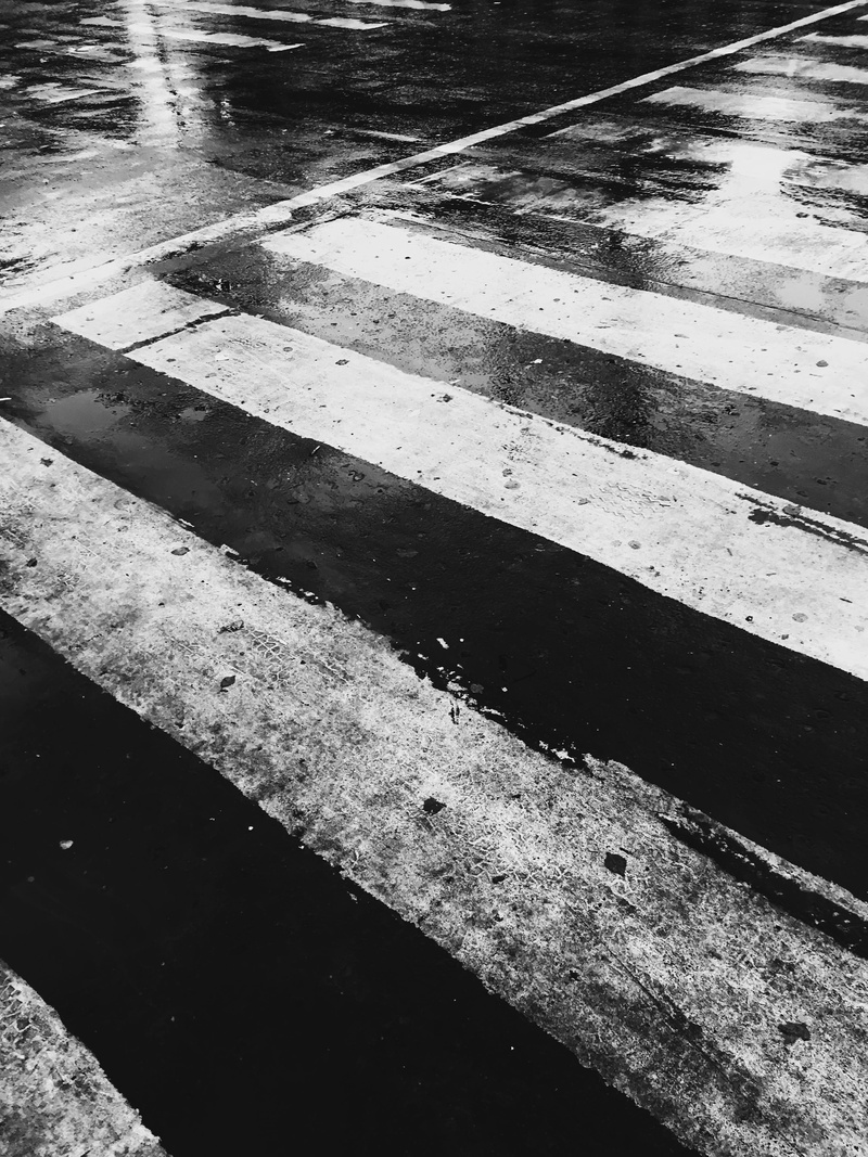 sign, clothing, outdoors, tarmac, asphalt, rainy season, 4K, pedestrian, gravel, dividing line, field, road marking, crossing, rain, building, corridor