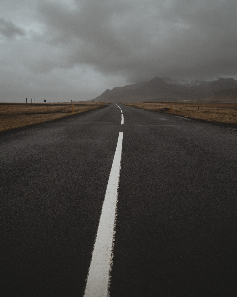 sphere, highway, daytime, zebra crossing, no people, building, tarmac, empty, tower, marking, dividing line, tar, asphalt, road, rug, day, transportation