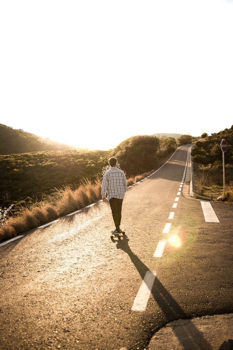 light, leisure activity, nature, sphere, casual clothing, tarmac, apparel, rear view, man, sunlight, lens flare, copy space, human, way, men, transportation