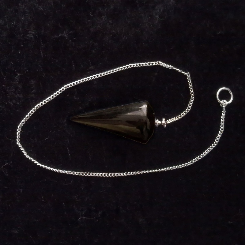 no people, black background, shiny, prediction, still life, necklace, pendant, equipment, close-up, mystic, metaphysical, quartz, mystical, single object