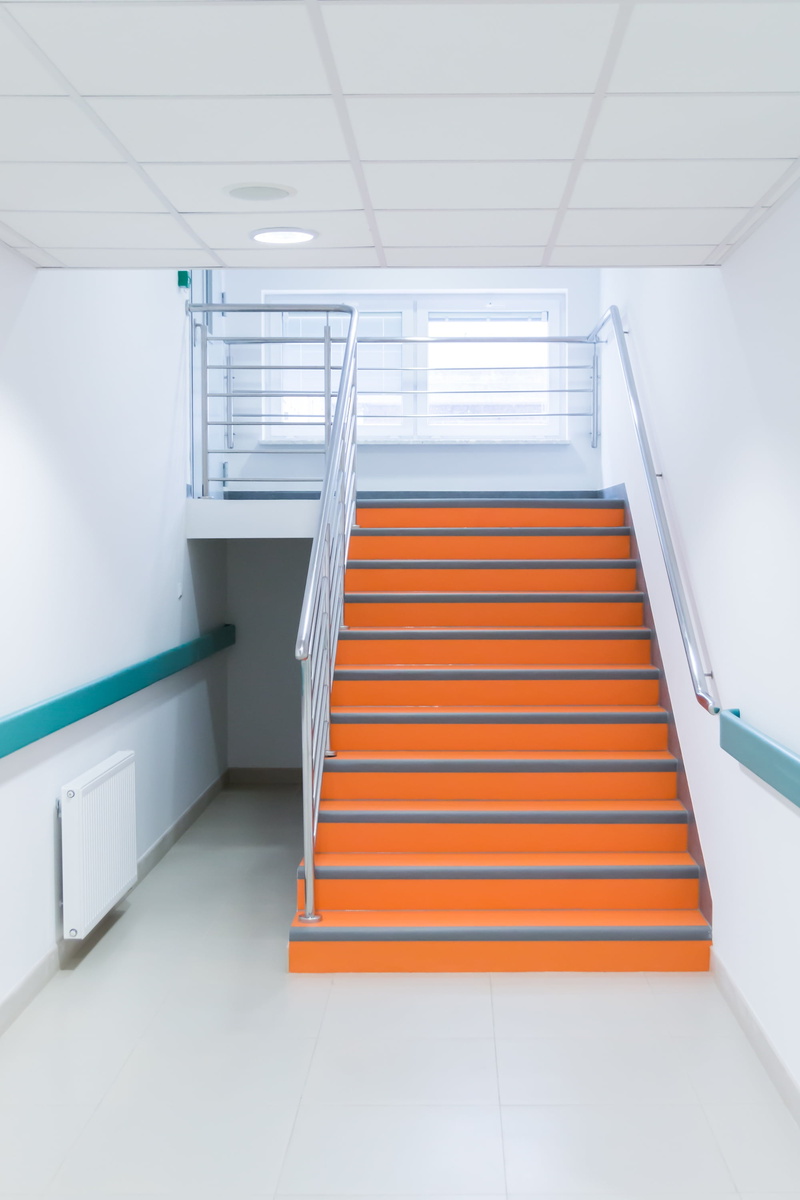 tiled floor, gray, ceiling, day, orange, indoors, stairs, stair, low angle view, staircase, railing, wall - building feature, steps and staircases, orange color
