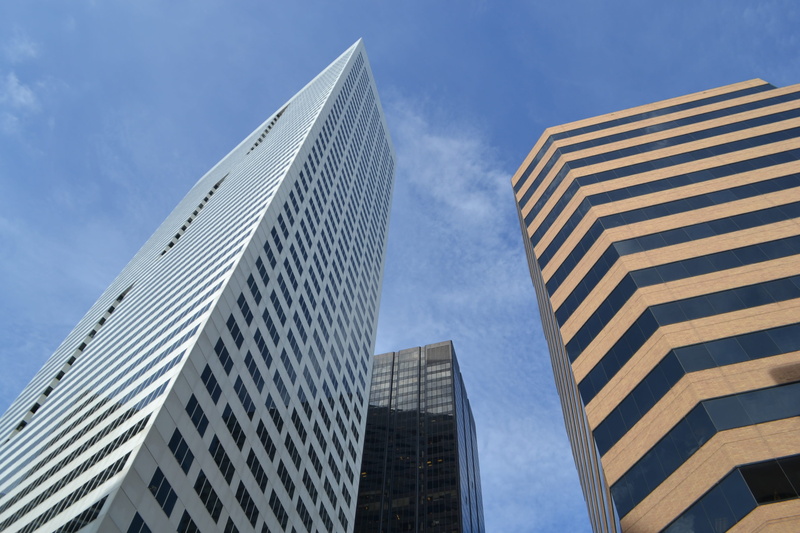 tall - high, no people, apartment, window, cloud - sky, built structure, growth, real-estate, low angle view, center, industrial, corporate, tower, financial