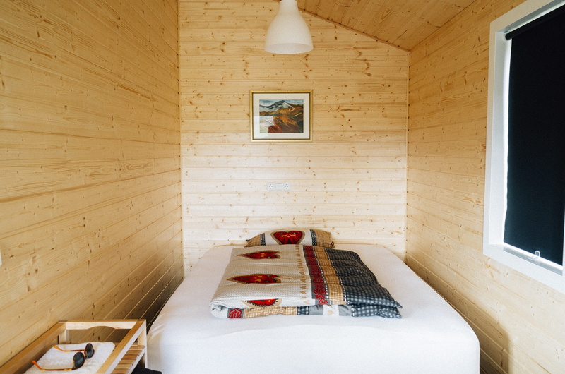 domestic room, high angle view, table, indoors, wood - material, picture, wood, white, home, seat, cozy, wooden, flooring, pillow, built structure, cabin