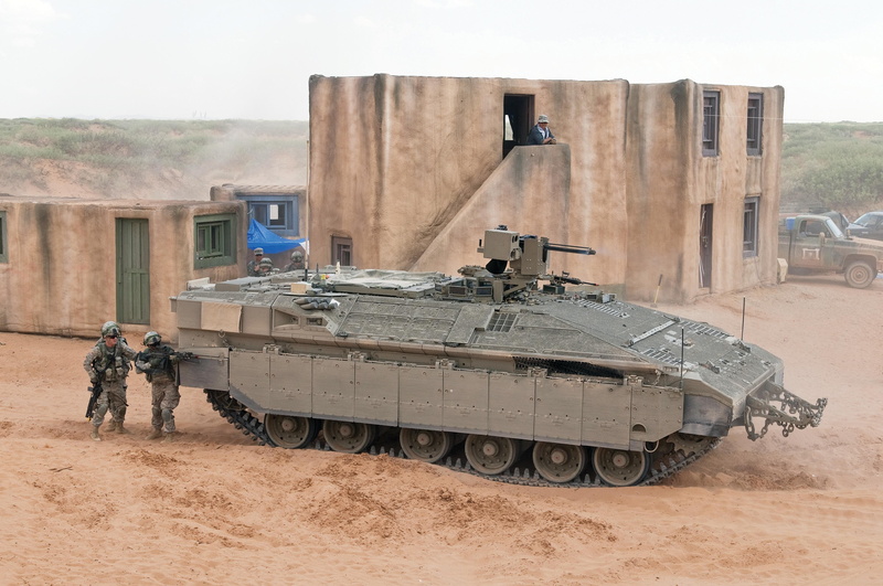 military, built structure, land vehicle, outdoors, architecture, land, mode of transportation, government, day, one person, security, transportation, tank