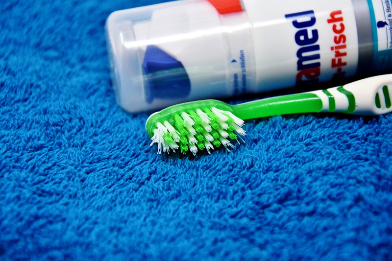 multi colored, dental care, science, green color, education, table, brush, health, hygiene, bathroom, indoors, tooth, bristles, nature, high angle view
