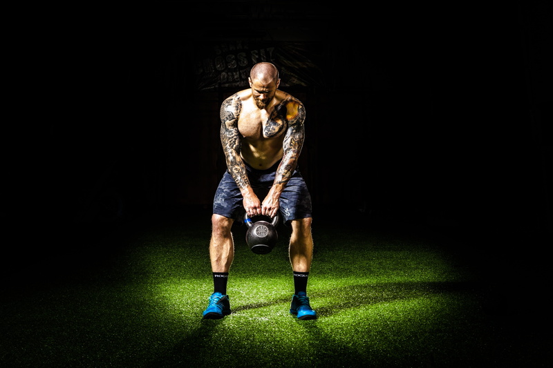 vitality, exercise, man, sports clothing, spotlight, weights, full length, clothing, strong, black, effort, grass, dark, determination, kettle, 5K, muscles