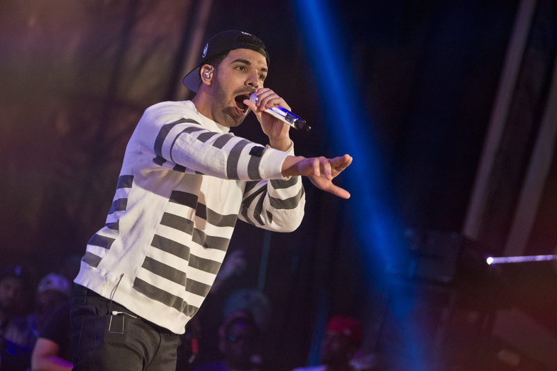 event, skill, stage - performance space, nightlife, drake, input device, holding, governors ball, stage light, performance, one person, microphone, artist