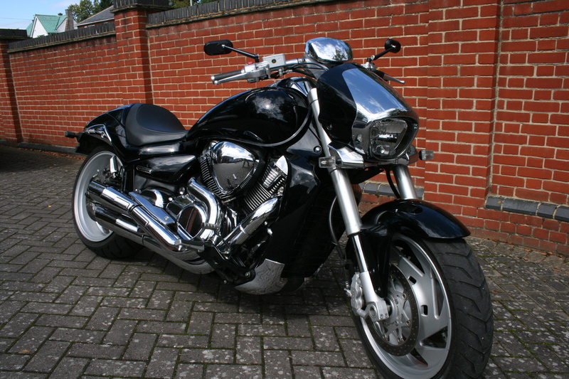 city, concrete, black, ride, pavement, machine, land vehicle, transportation, brick wall, parking, race, chopper, footpath, wall, mode of transportation
