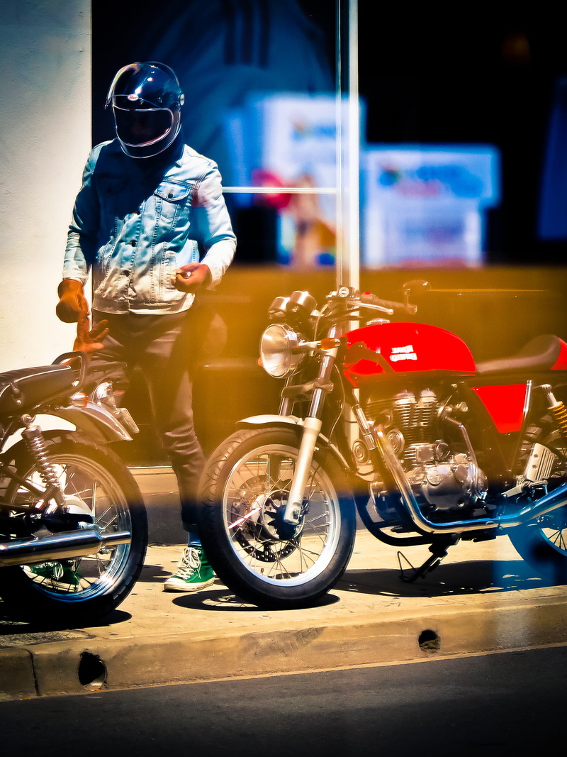 red and black, mode of Transport, sports helmet, near, blurred motion, land vehicle, transportation, urban Scene, biker, crash helmet, red, people, one person