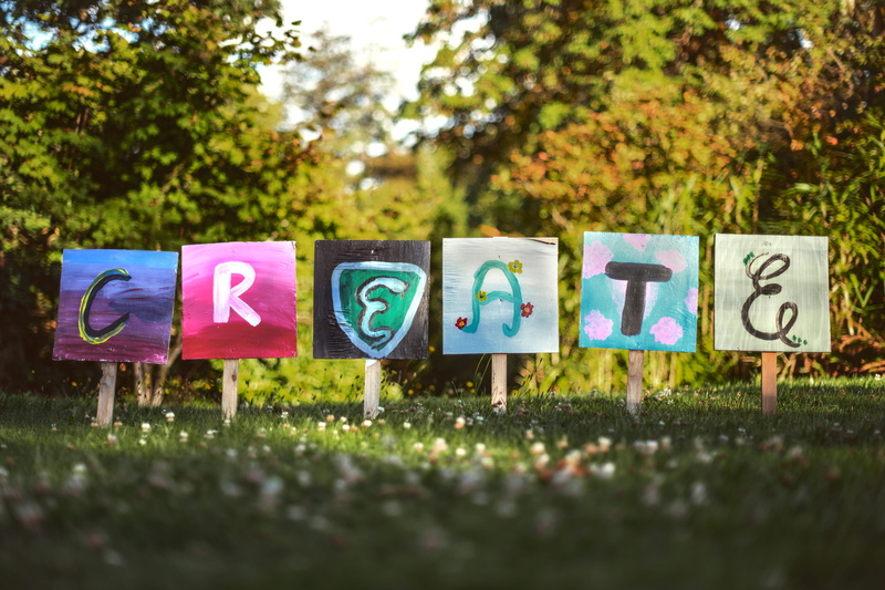 land, letter, multi colored, design, side by side, field, communication, grass, no people, text, newberg, united states, sign, nature, art and craft, lawn