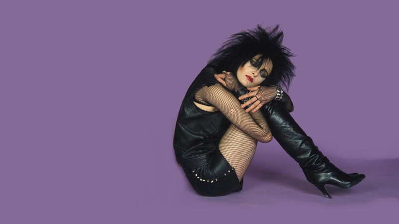 one person, black hair, leather, portrait, colored background, copy space, beautiful woman, music, indoors, purple, studio shot, human body part, adult