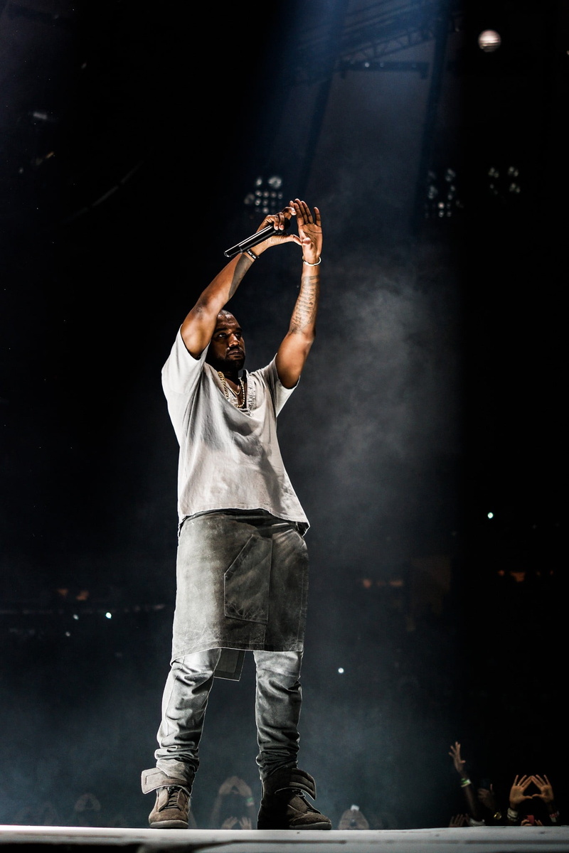 gray, stage - performance space, holding, black background, arms raised, standing, sleeved, adult, Kanye West, arts culture and entertainment, smoke - physical structure