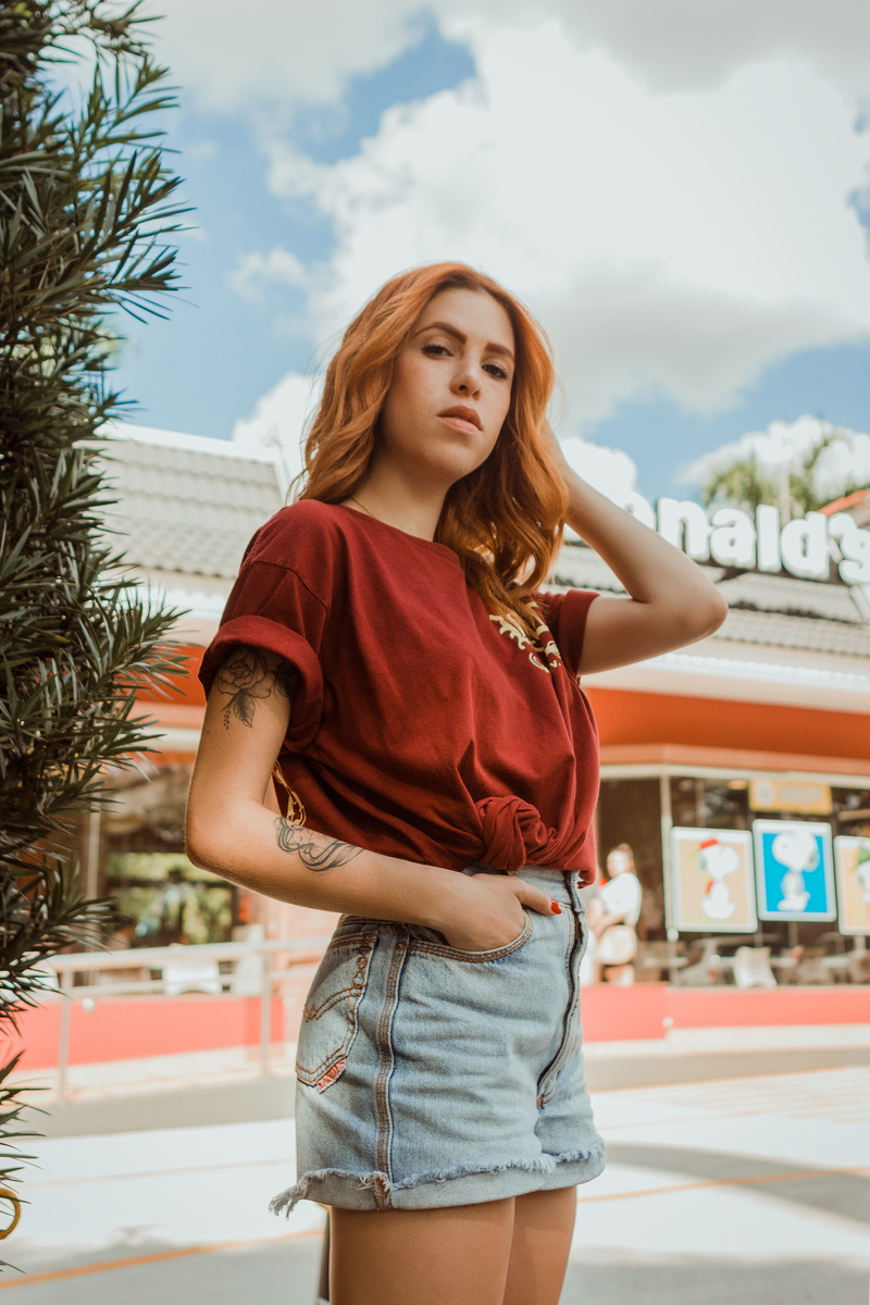 leisure activity, long hair, focus on foreground, putting, vinatge, one person, teenager, 4K, tree, tropical, modern greenery, near, stading, mcdonald