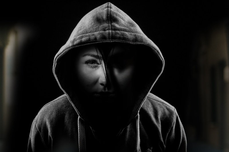 teenager, men, front view, psyche, portrait, hood, grey, contemplation, obscured face, despair, black background, one person, psycho, serious, sweatshirt
