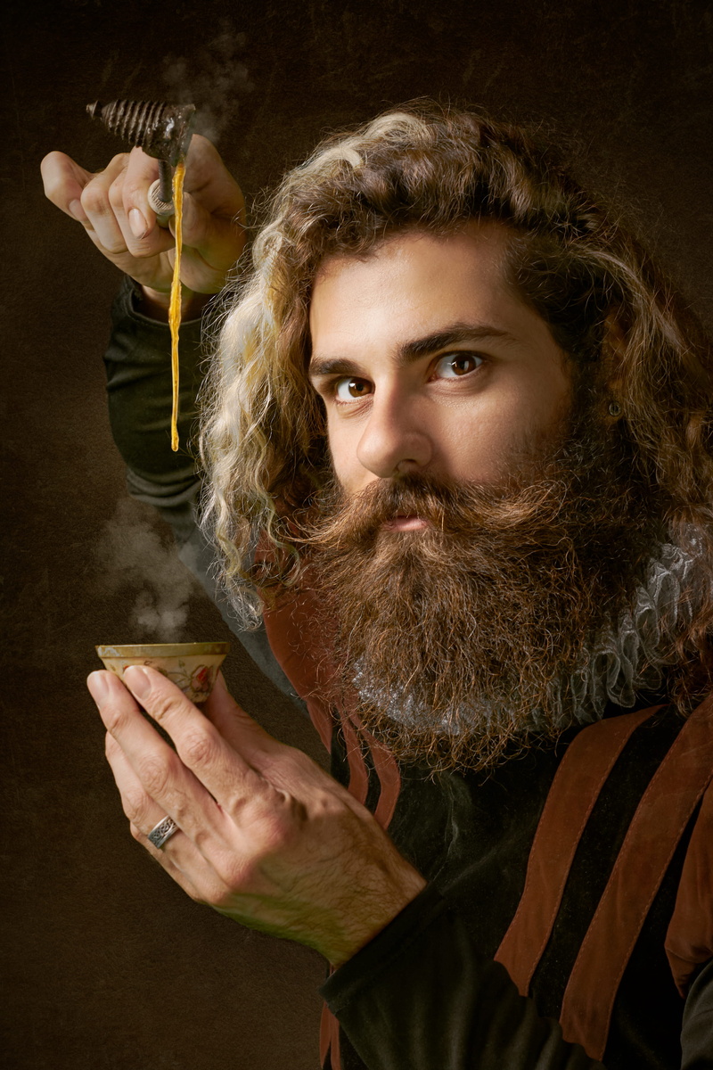 senior citizen, insanity, headshot, beard, indoors, hairstyle, looking at camera, front view, knowledge, facial hair, gold, chemistry, curiosity, one person