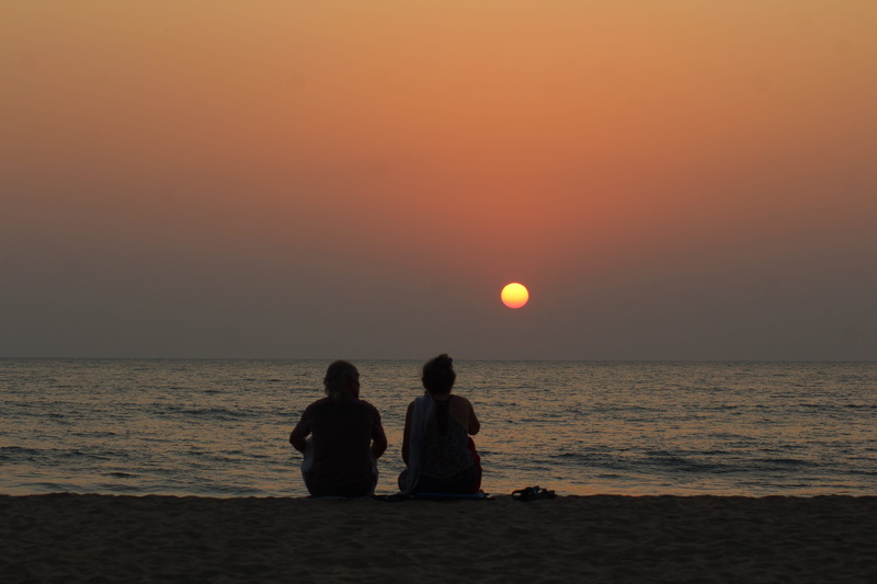 silhouette, orange color, help, positive emotion, leisure activity, love, sea, india, sun, couple - relationship, people, horizon over water, rear view