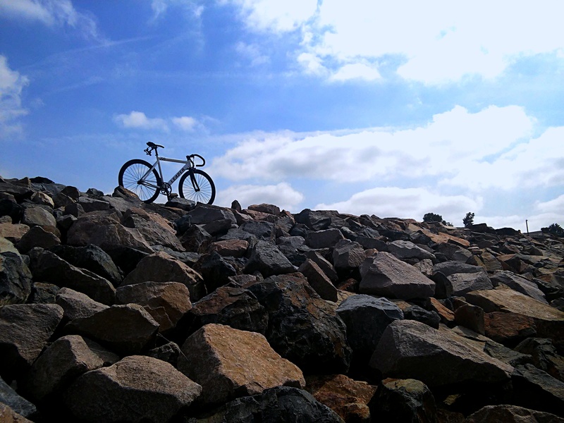 sky, silhouette, city, race, dom, recreation, style, cycling, cliff, low, outdoor, haven, wheel, transportation, speed, journey, no people, cloud, beauty in nature