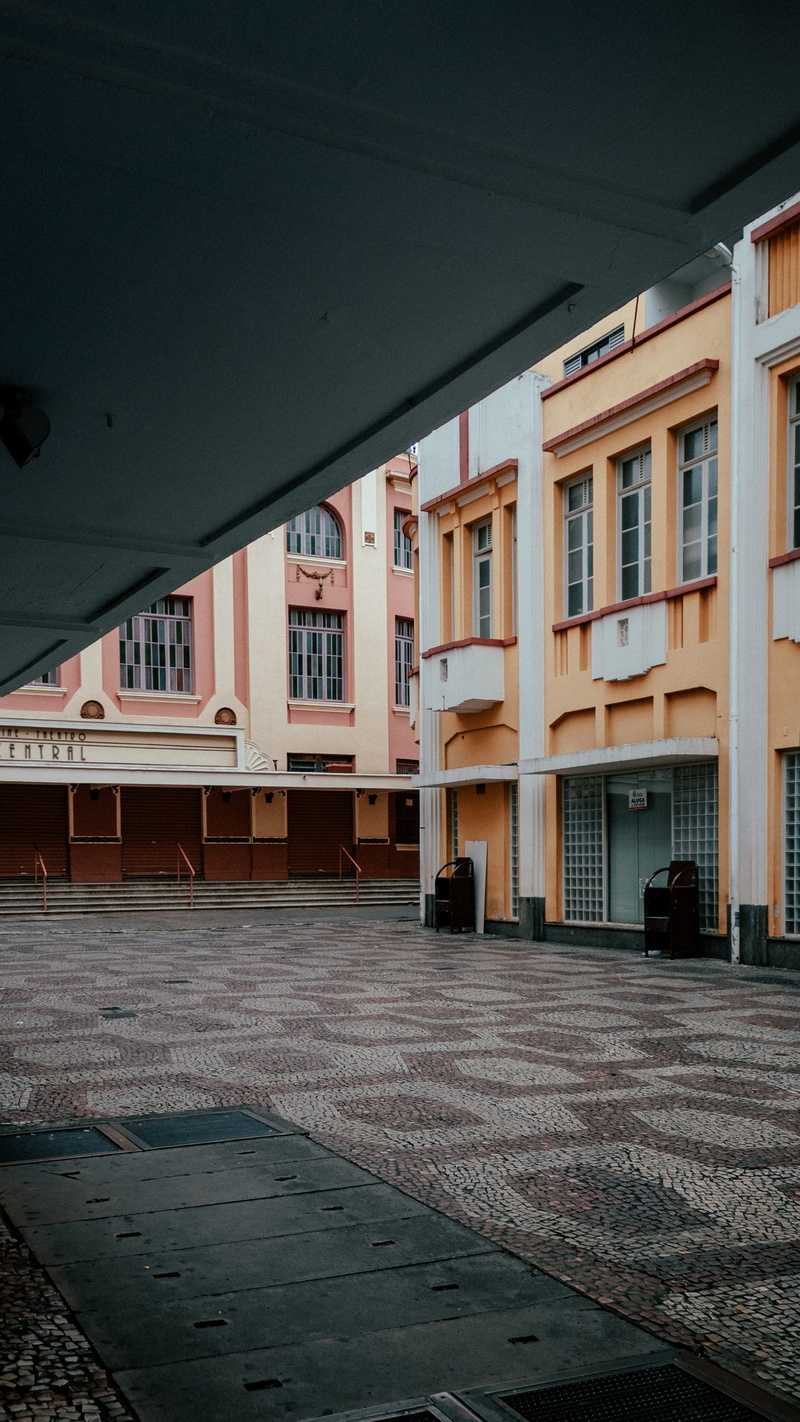 building exterior, road, window, architectural column, empty, rug, no people, orange, built structure, outside, concrete, floor, downtown, white