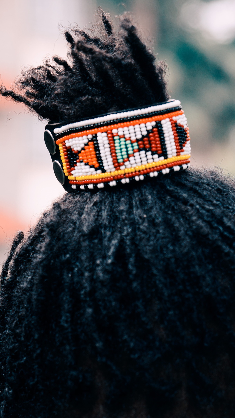 closeup, kenya, multicolored, tie, real people, focus on foreground, day, one person, beaded, black hair, scarf, clothing, white, close-up, tree, emblem