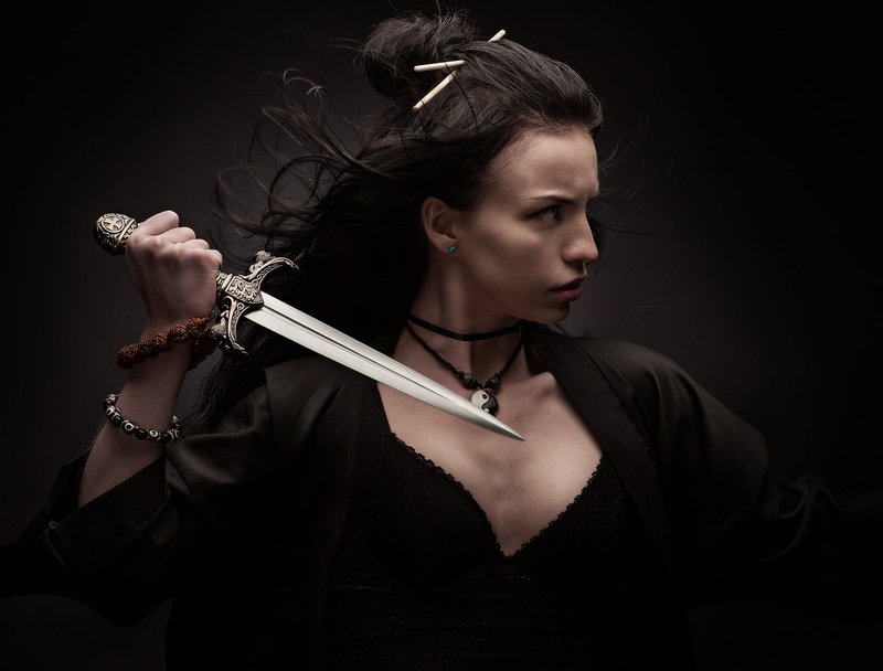 dark, cleavage, beautiful people, studio shot, one person, evil, portrait, black color, social issues, indoors, young adult, model, holding, knife - weapon