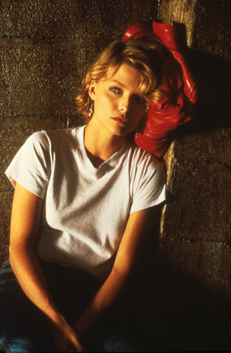 2K, portrait, red, teenager, one person, indoors, contemplation, serious, hair, casual clothing, women, looking at camera, depression - sadness, sitting