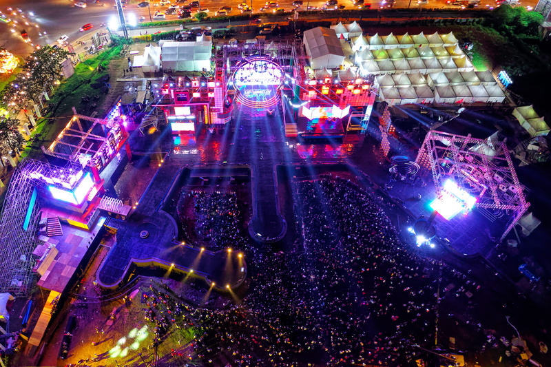 view, real people, stage, glowing, place of worship, crowd, festival, spirituality, group of people, light - natural phenomenon, travel destinations, drone