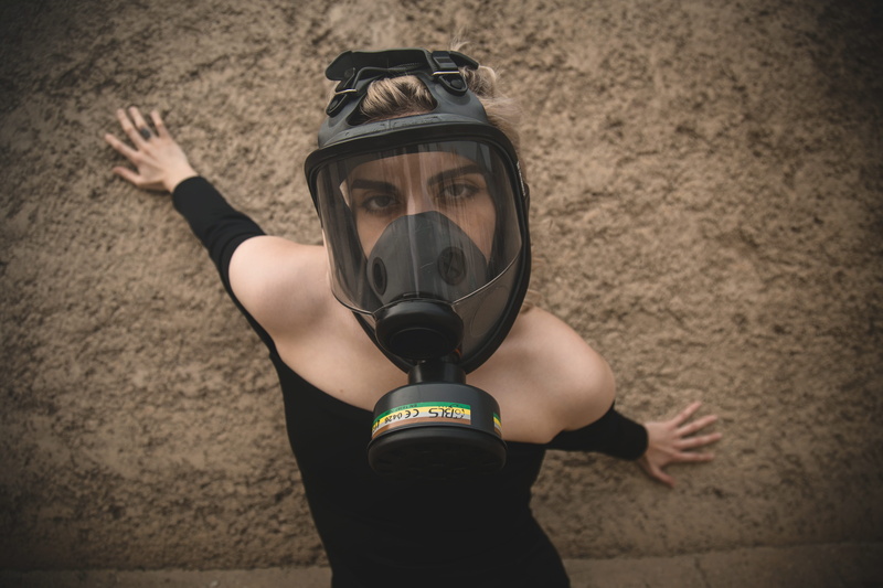 clothing, black, standing, wall - building feature, leisure activity, young adult, respirator, mask, front view, real people, shoulder, woman, looking at camera