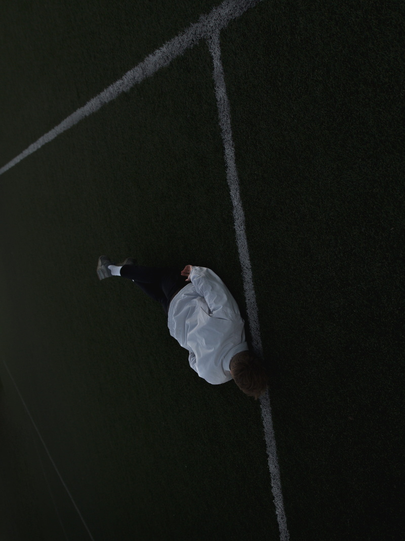 leisure activity, soccer, ground, rear view, guy, rope, mood, day, 2K, man, white, falling, moody, real people, outside, sport, lying, pitch, casual clothing