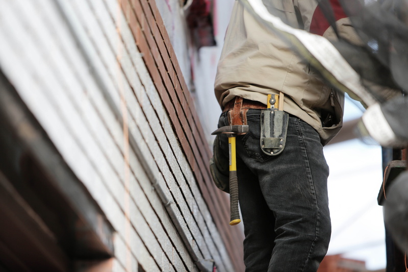 carpenter, worker, selective focus, human leg, construction, social issues, body part, midsection, safety, contractor, jeans, uniform, real people, hammer