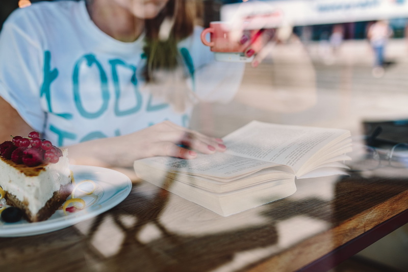 book, childhood, food, lifestyles, offspring, woman, one Person, table, glass, indoors, one girl only, real people, front view, reading book, sitting, cafeteria