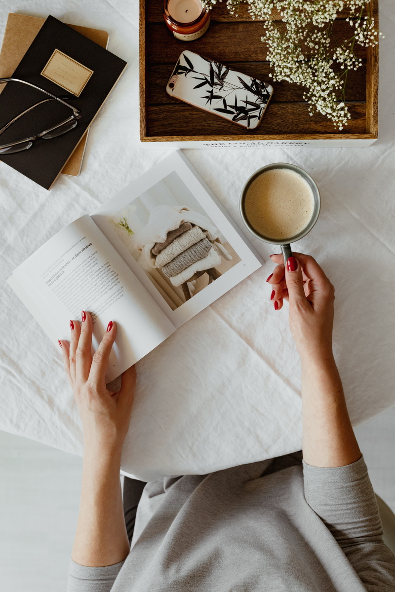 drink, opened book, flat lay, hands, read, woman, top view, real people, high angle view, leisure activity, directly above, time, mug, table, late, book
