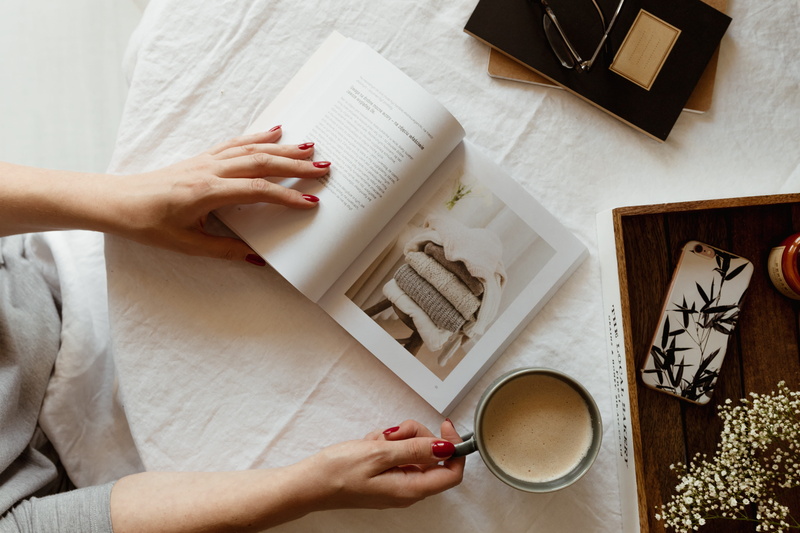 adult, one person, table, women, drink, food and drink, relaxing, top view, indoors, human body part, read, time, directly above, opened book, high angle view