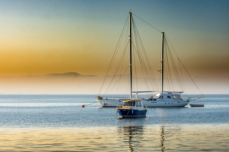 fish, tranquil scene, horizon, water, mode of transportation, boat, bay, outdoors, tuzla bay, horizon over water, sunset, sky, sailboat, scenics - nature