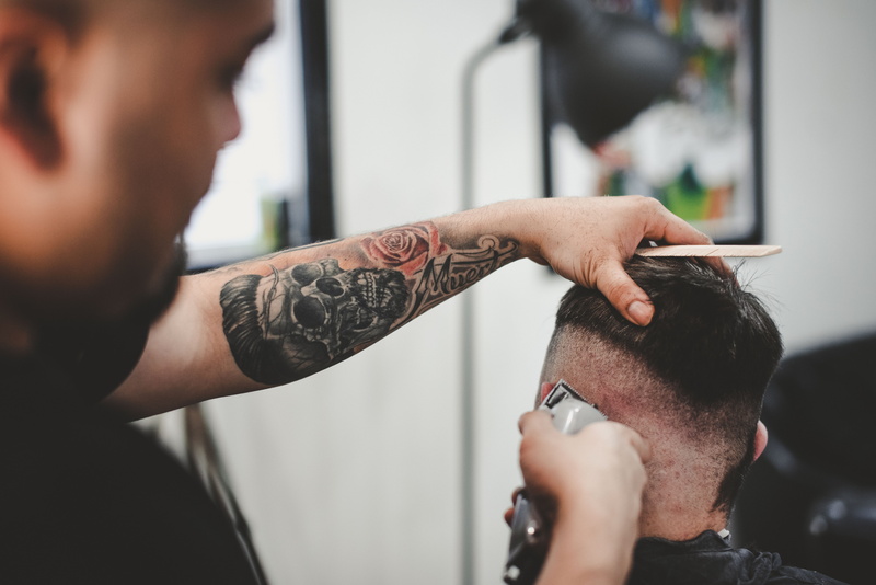 expertise, hairdresser, haircut, real people, customer, human body part, art and craft, hairstyle, creativity, skin fade, clipper, young adult, two people