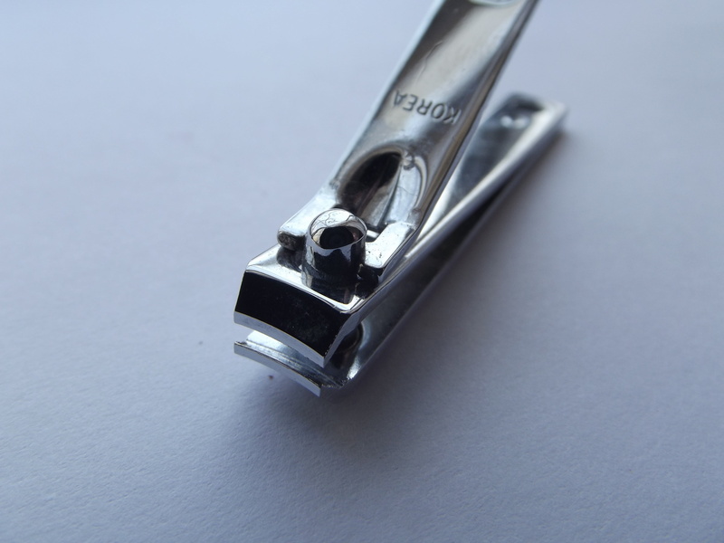 studio shot, silver, blue, indoors, hygiene, nail clippers, fountain pen, steel, no people, blue background, nail, silver colored, high angle view, two objects
