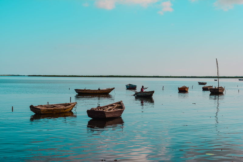 non-urban scene, tropical, rustic fishing boat, tranquil, wood boat, no people, horizon over water, moored, 5K, rowboat, peaceful, fishing boats, sunset