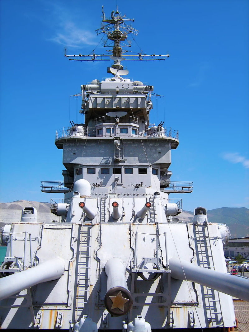 flagship, armed, built structure, war, harbor, tower, no people, battleship, weapon, mighty, sky, large, outdoors, low angle view, boat, blue, armor, sea