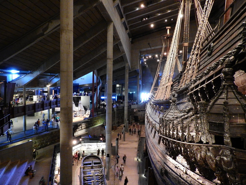 indoors, warship, incidental people, mode of transportation, canal, ship, architecture, illuminated, museet, fuel and power generation, reflection, transportation