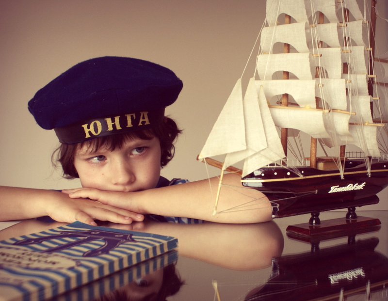 table, hat, boys, sitting, 2K, childhood dream, view, cap, looking at camera, sailboat, males, sailor, men, photoshoot, model, dream, childhood, real people