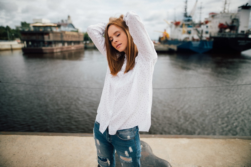 pier, open mouth, auburn, ship, women, portrait, depth of field, closed eyes, 1080P, denim, model, white shirt, polka dots, arms up, jeans