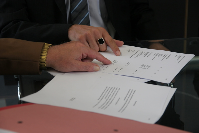 2K, adult, convention, man, printing, sign, holding, annual event, secretary, arrangement, human body part, writing, black, ring, contract, desk, real people
