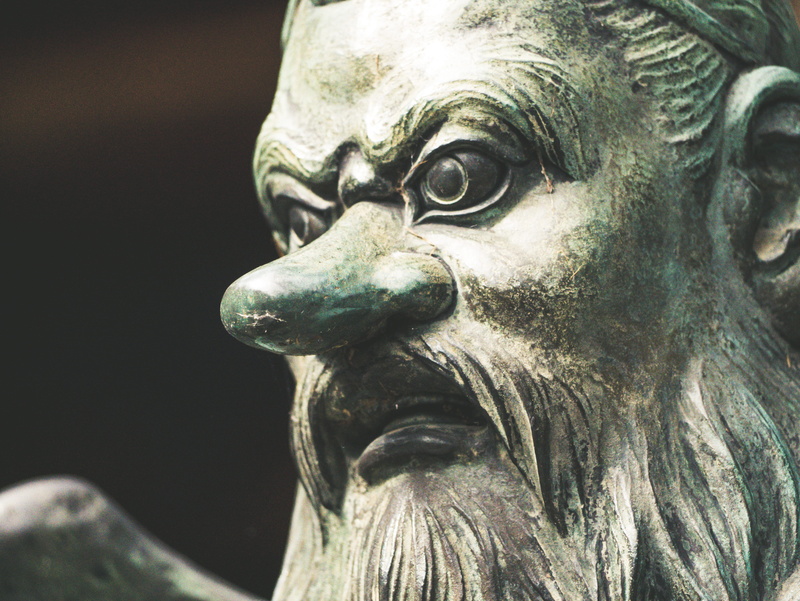 nickel, goblet, figurine, male likeness, archaeology, creativity, alien, man, sculpture, close-up, ornate, suit, jacket, outdoors, day, head, bird, animal