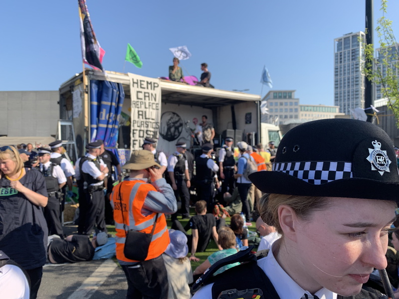 street, apparel, 4K, crowd, helmet, building exterior, person, large group of people, safety, building, people, hat, police, government, protestor, architecture