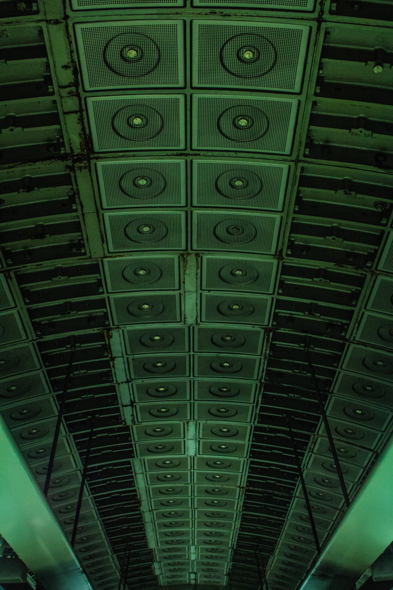 indoors, built structure, tube, roof, green color, shape, dark, underground, futuristic, close-up, closed, green, pattern, abstract, space, protection