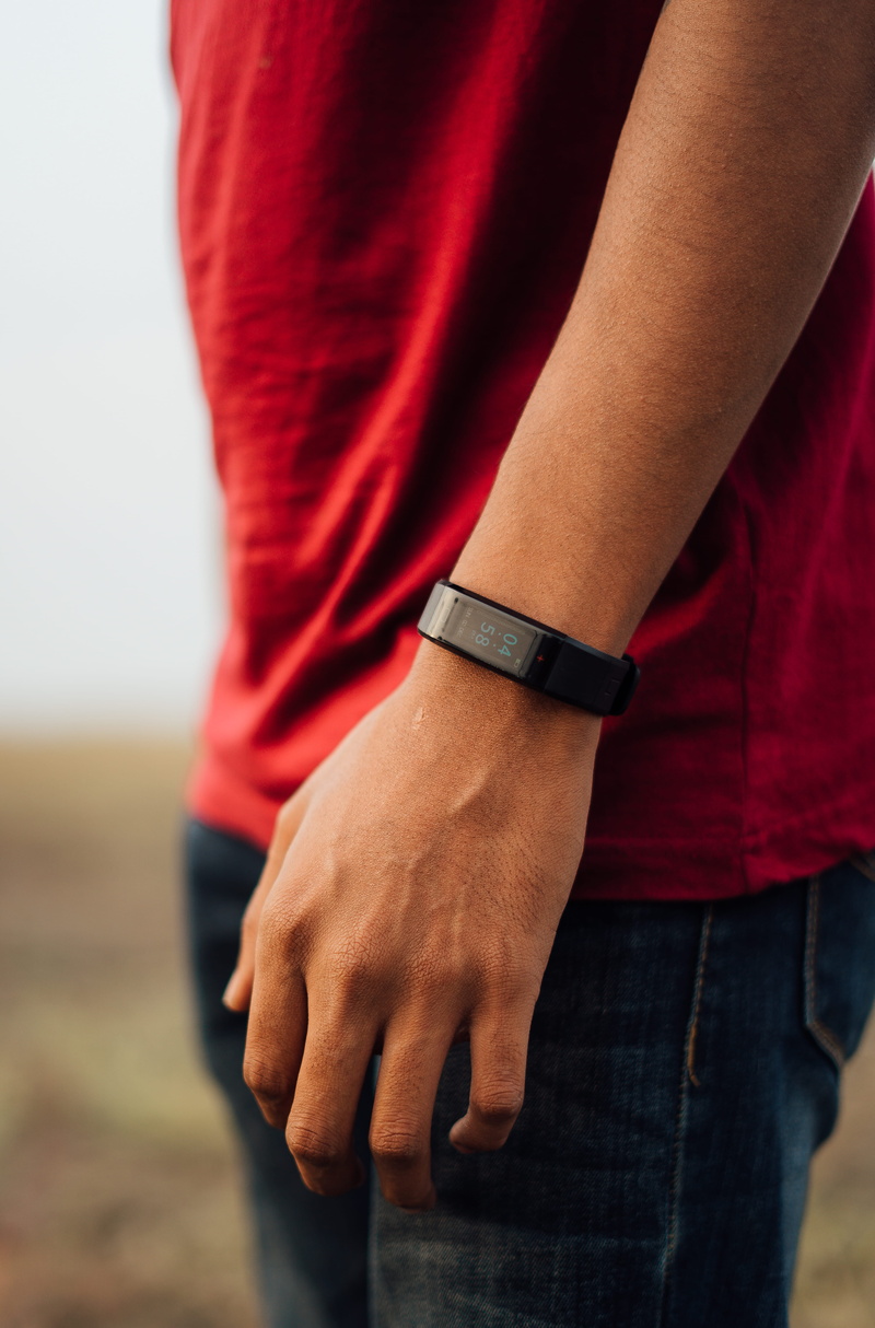 arm, wrist, bronze, finger, handrail, black, human hand, wristwatch, adult, midsection, crime, strap, hand, digital watch, tracker, human body part, banister