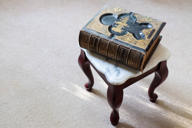 testament, high angle view, sunlight, book, finance, human body part, christianity, christian, family bible, holy, currency, business, ancient text, shadow
