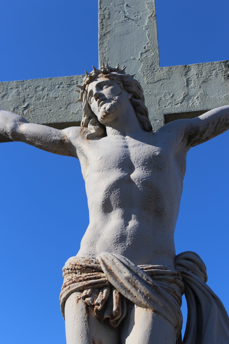 outdoors, art and craft, low angle view, cemetery, jesus, sky, day, jesus christ, statue, spirituality, cross, christianity, crucifixion, representation