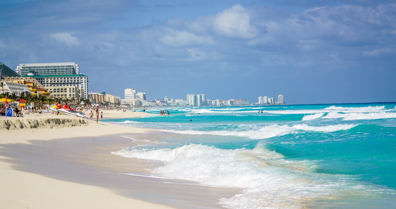 cloud - sky, beach, blue, land, sky, ocean, tourism, horizon over water, outdoor, cityscape, sand, hotel, motion, white, aquatic sport, landscapes, power in nature